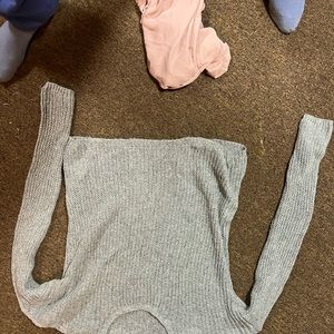 Women’s sweater with light sparkles that shows through material.